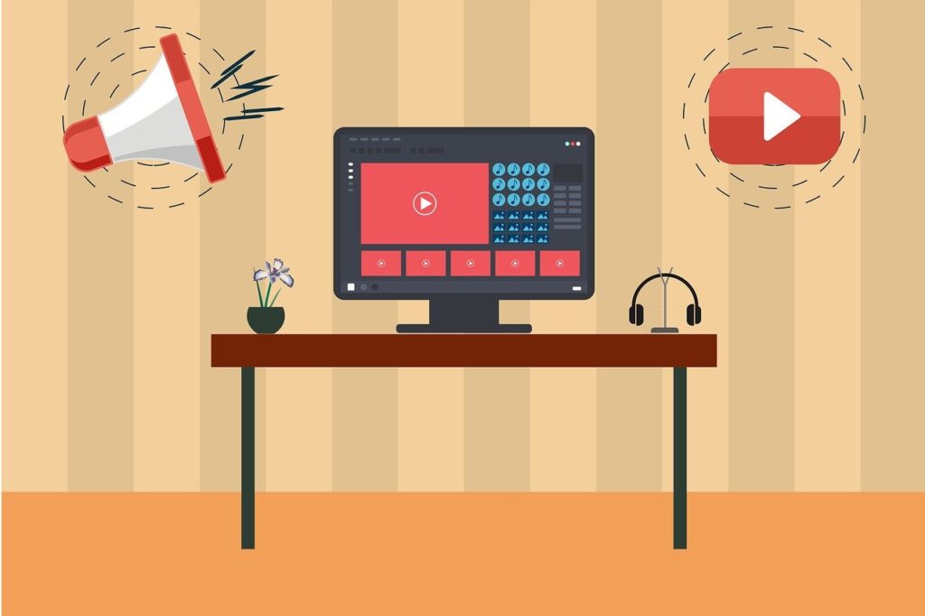 computer on a desk with media icons floating above the desk.